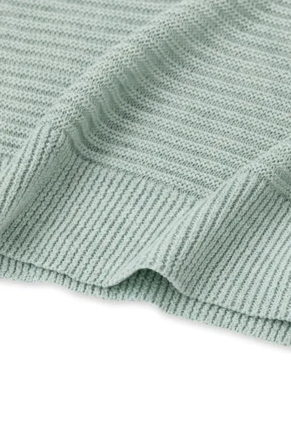 Ladies V‑Neck Knitted Pullover and White Cami Set