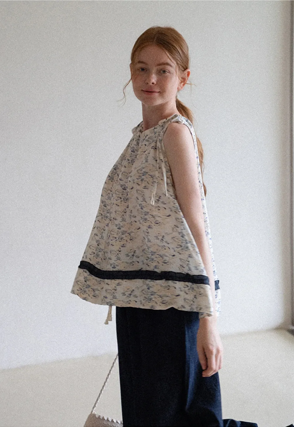 Floral Sleeveless Blouse with Ruffle Hem