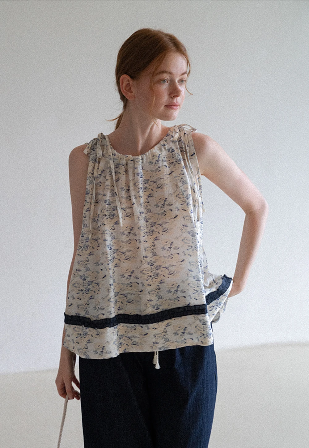 Floral Sleeveless Blouse with Ruffle Hem