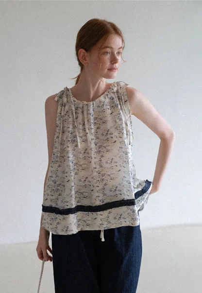Floral Sleeveless Blouse with Ruffle Hem