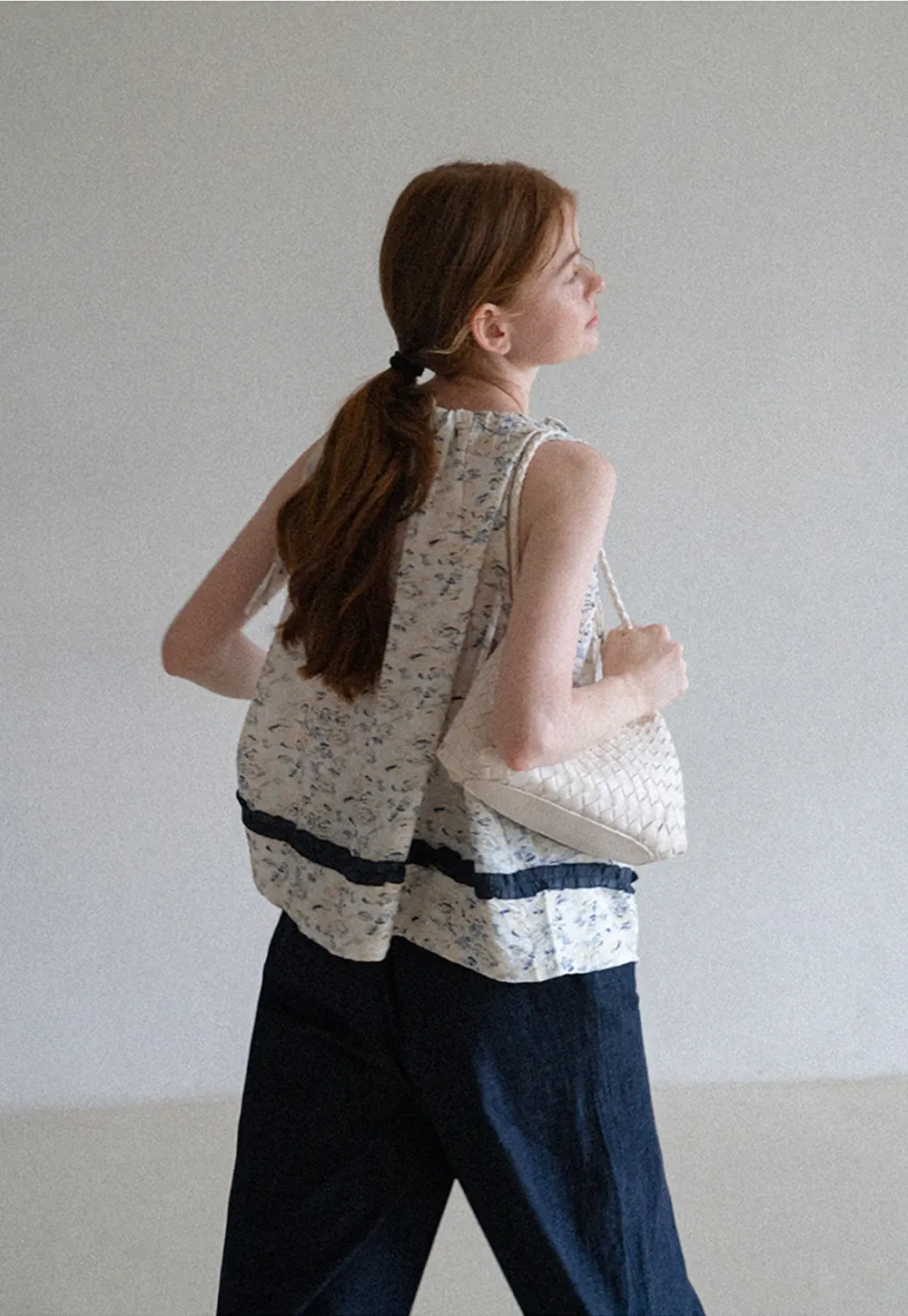 Floral Sleeveless Blouse with Ruffle Hem