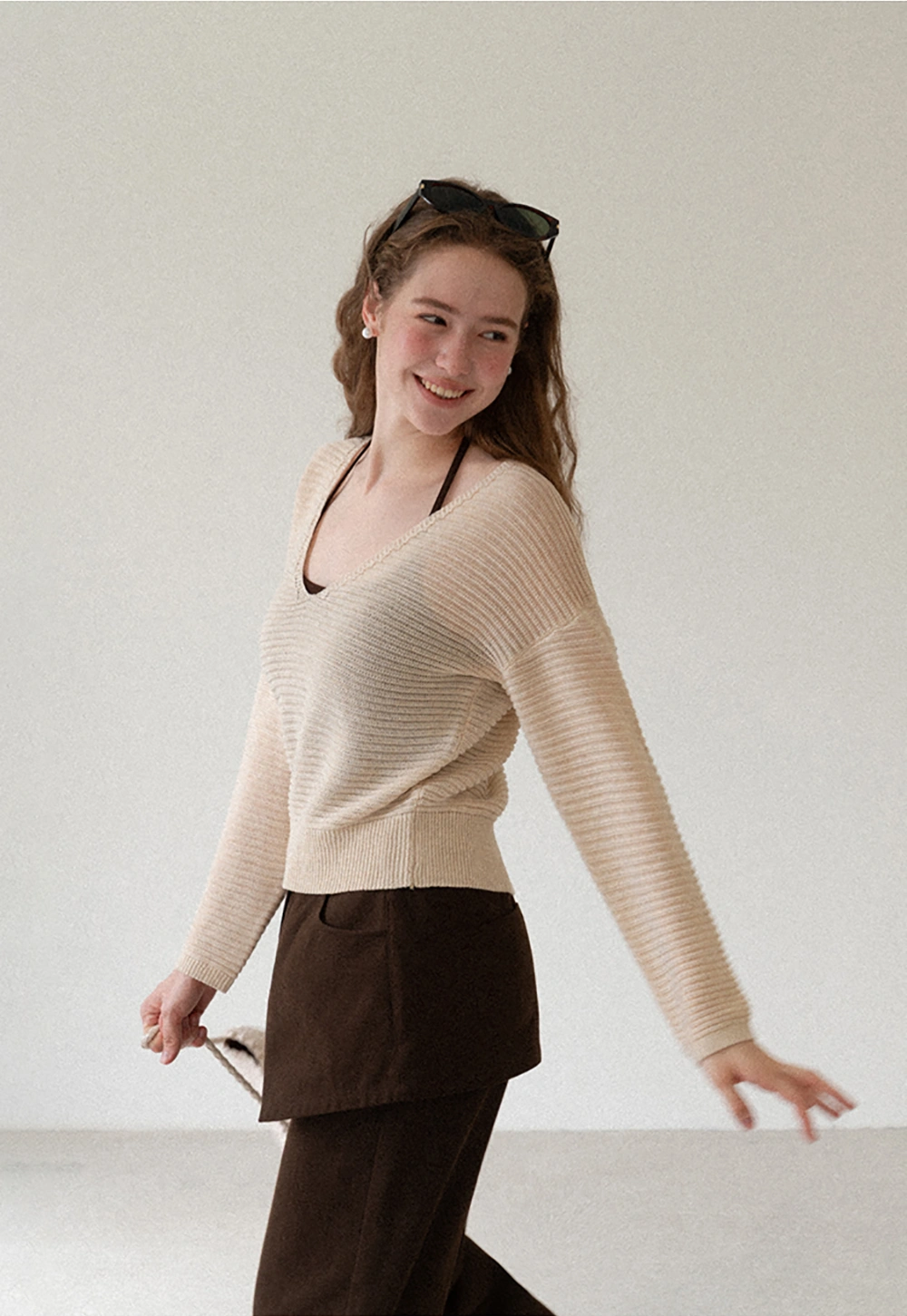 Ladies V‑Neck Knitted Pullover and White Cami Set