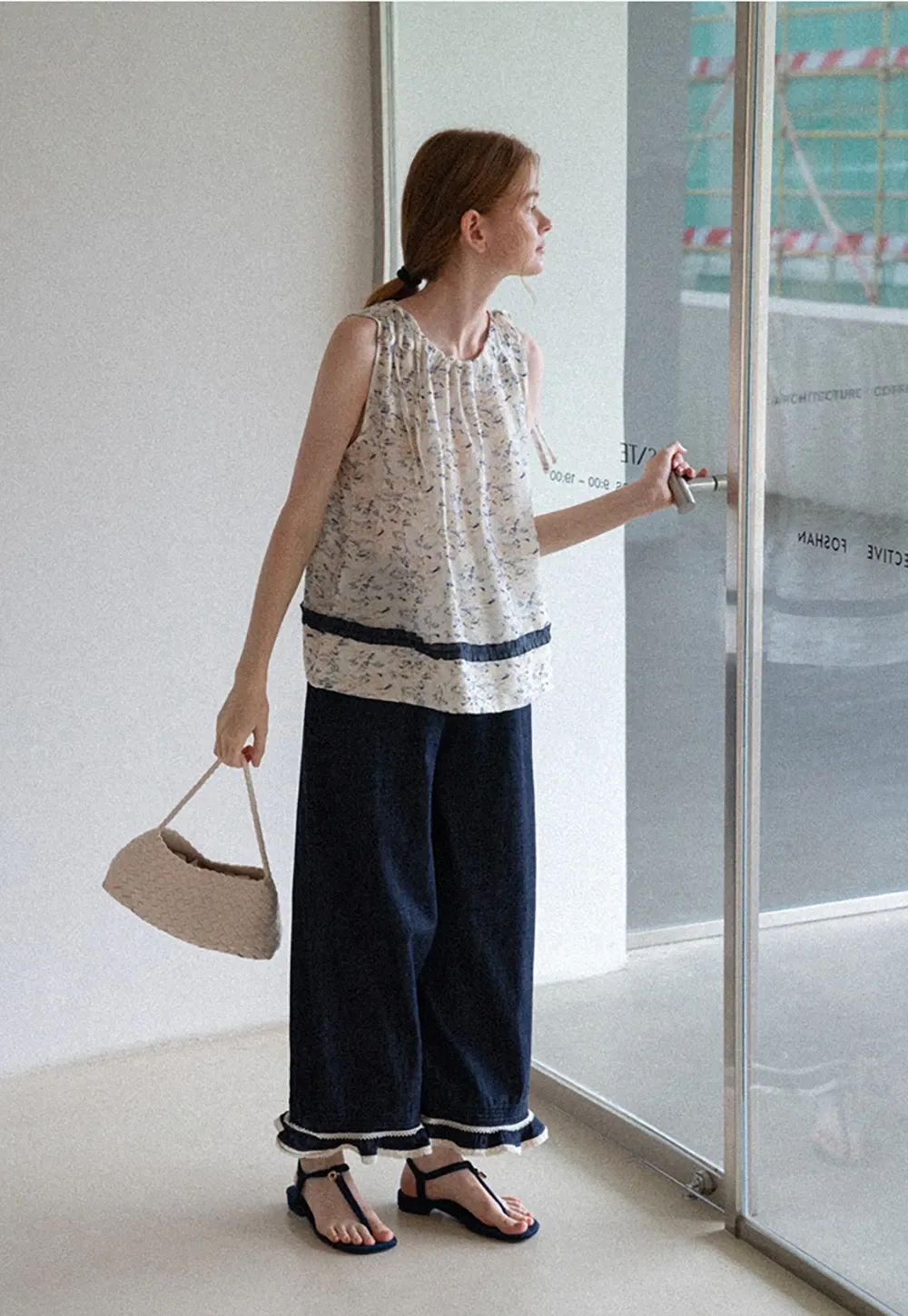 Floral Sleeveless Blouse with Ruffle Hem