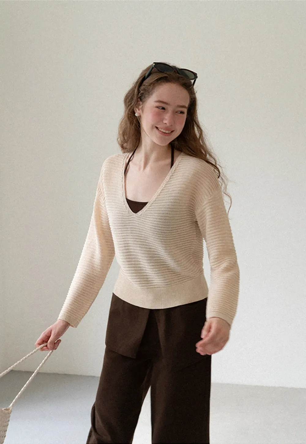 Ladies V‑Neck Knitted Pullover and White Cami Set
