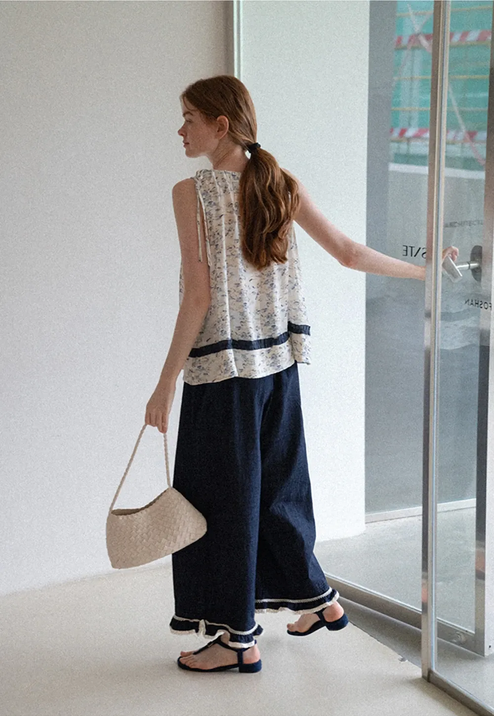 Floral Sleeveless Blouse with Ruffle Hem