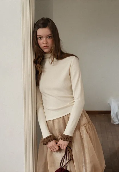 Soft Turtleneck Top with Ruffled Sleeve Cuffs
