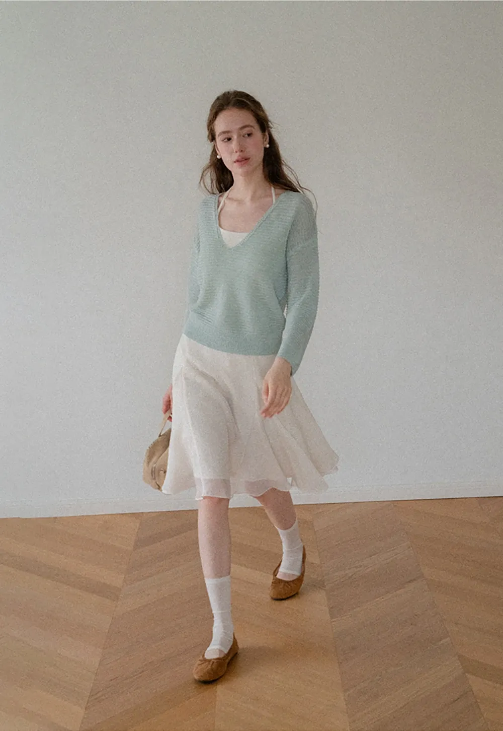 Ladies V‑Neck Knitted Pullover and White Cami Set