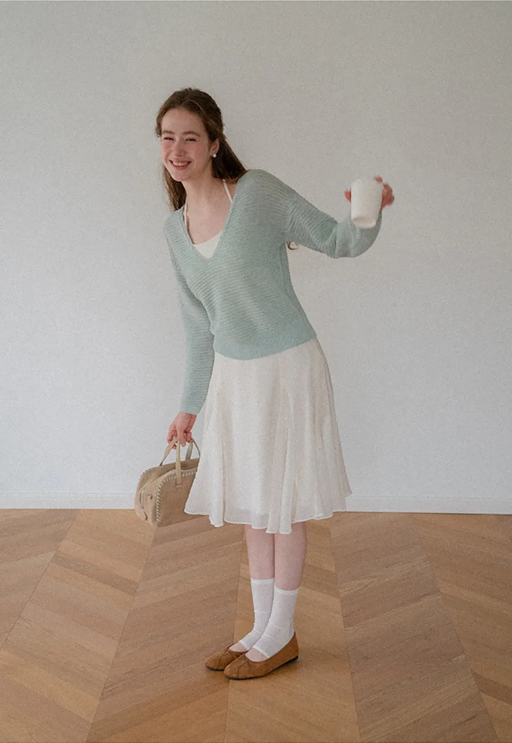 Ladies V‑Neck Knitted Pullover and White Cami Set