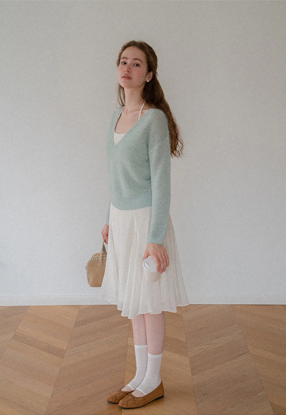 Ladies V‑Neck Knitted Pullover and White Cami Set