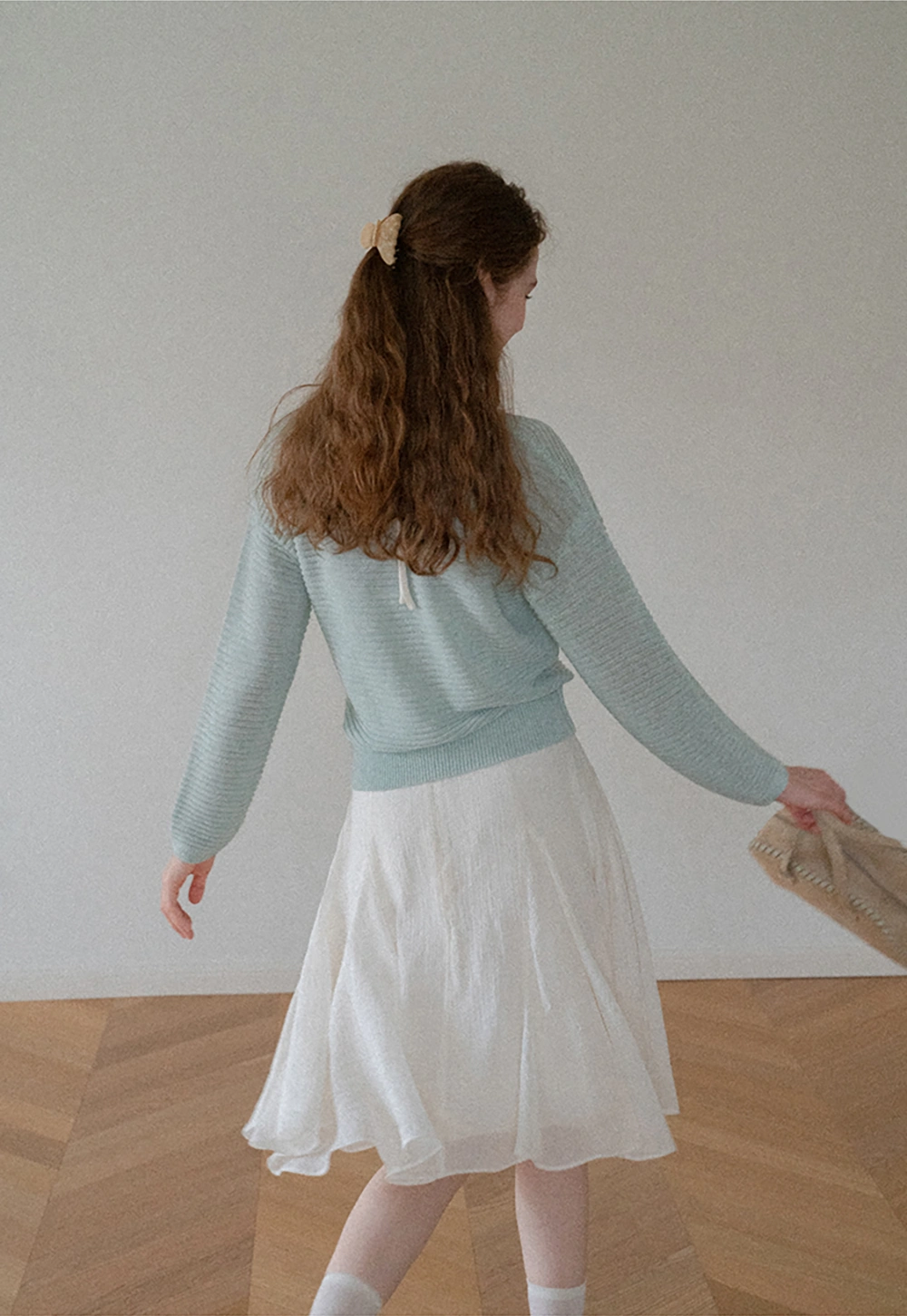 Ladies V‑Neck Knitted Pullover and White Cami Set