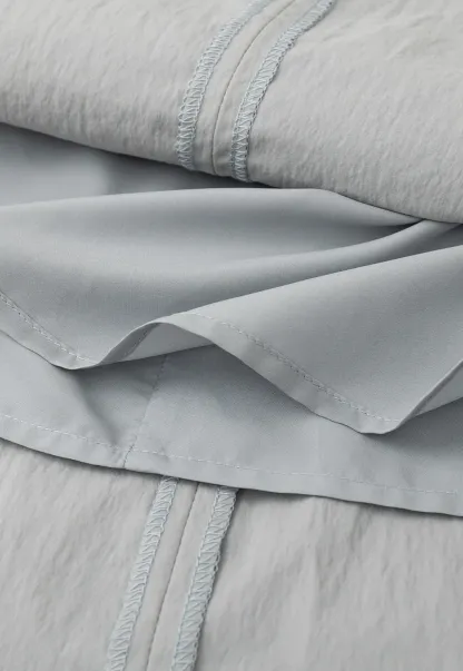 Sleeveless dress with Peter Pan collar and bow detail