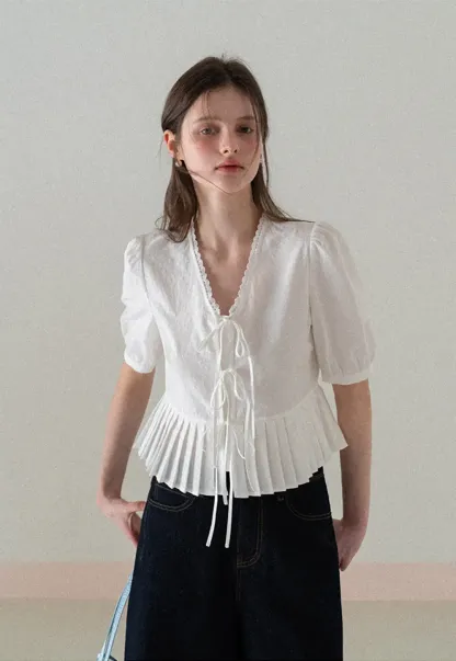 V neck short sleeve blouse with pleated hem and tie front