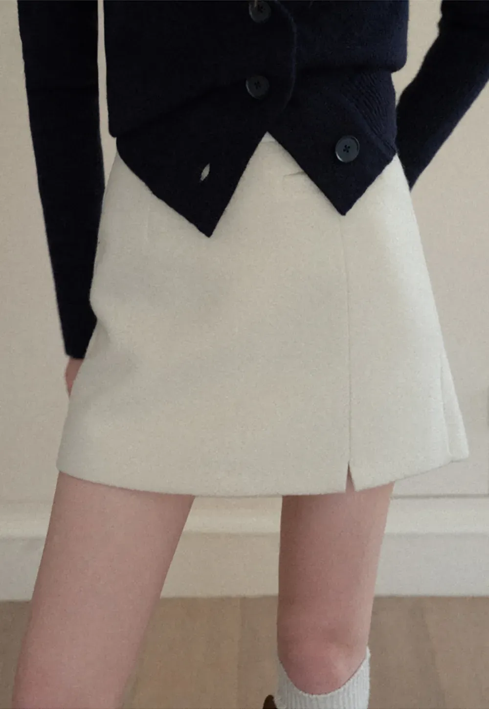 A-line mini skirt with textured fabric and central seam design