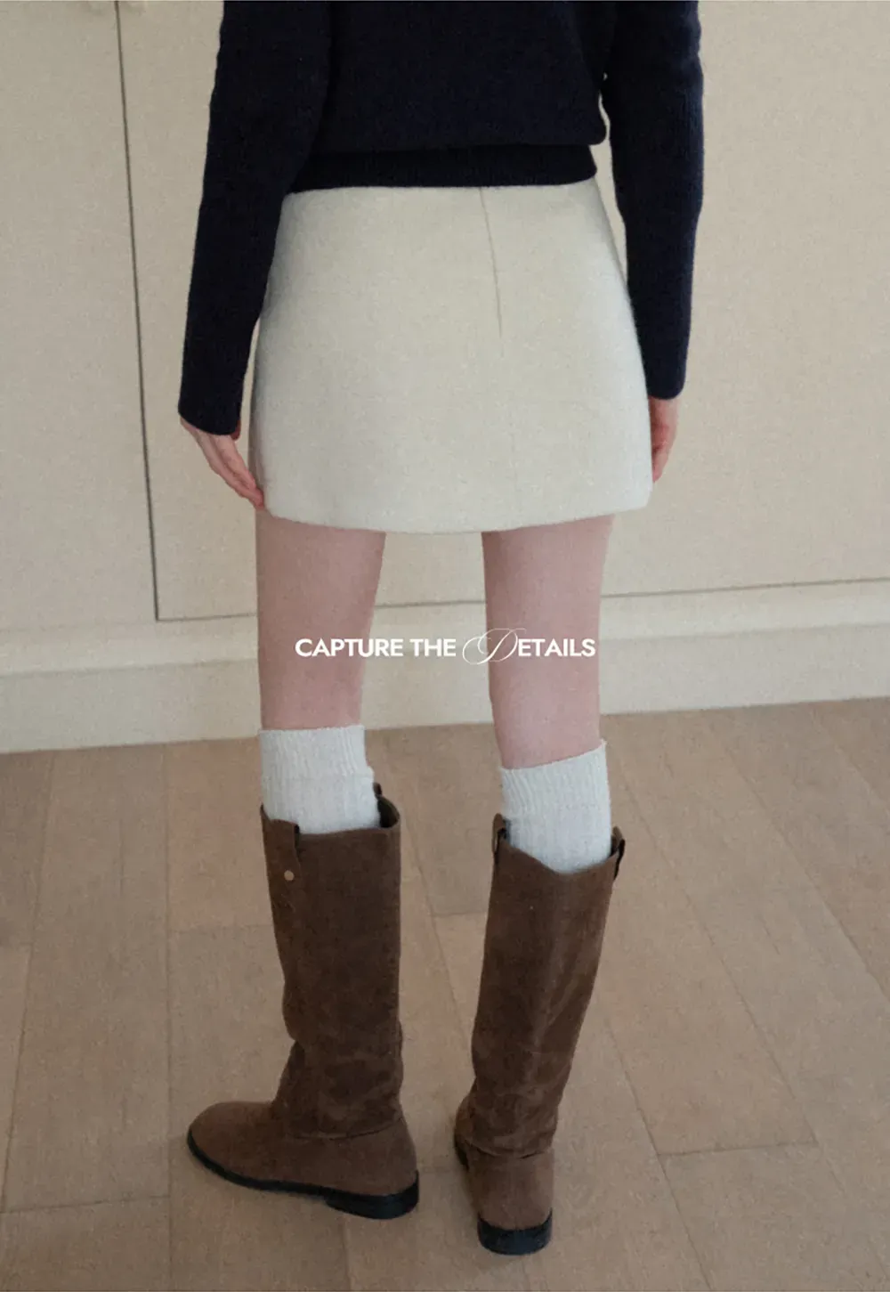 A-line mini skirt with textured fabric and central seam design