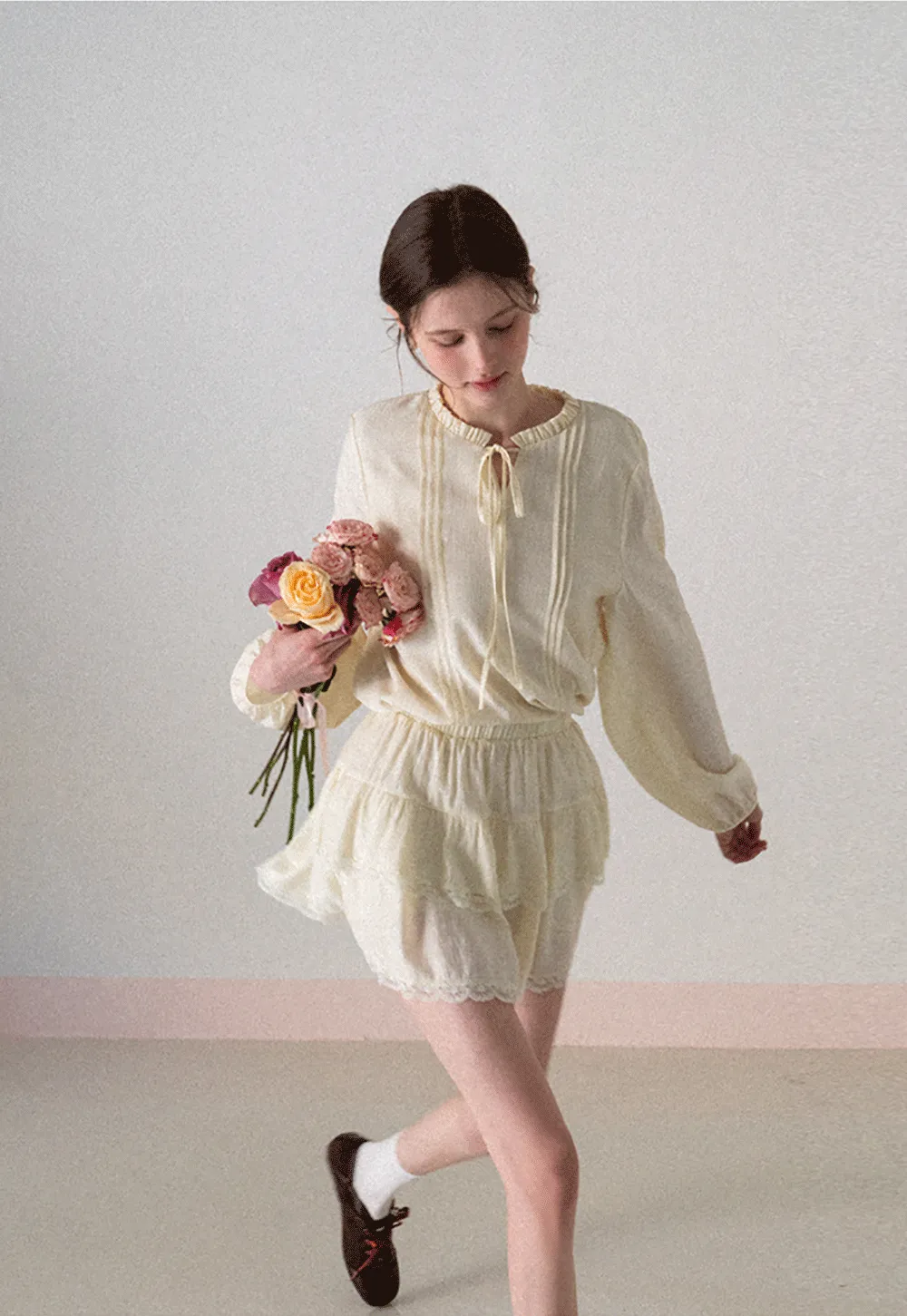 Shirt with ruffled collar and tie front layered skirt