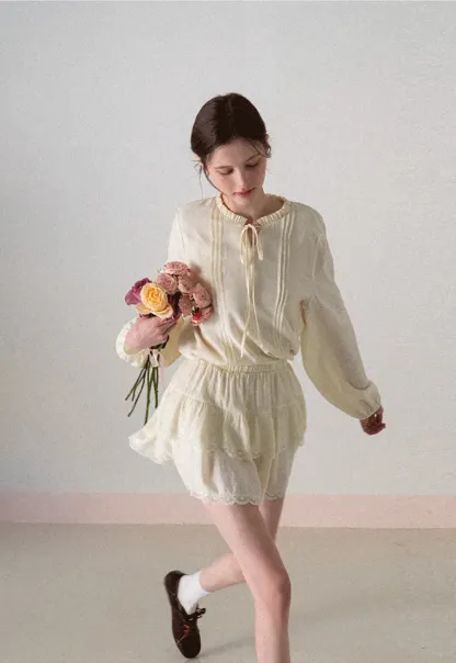 Shirt with ruffled collar and tie front layered skirt