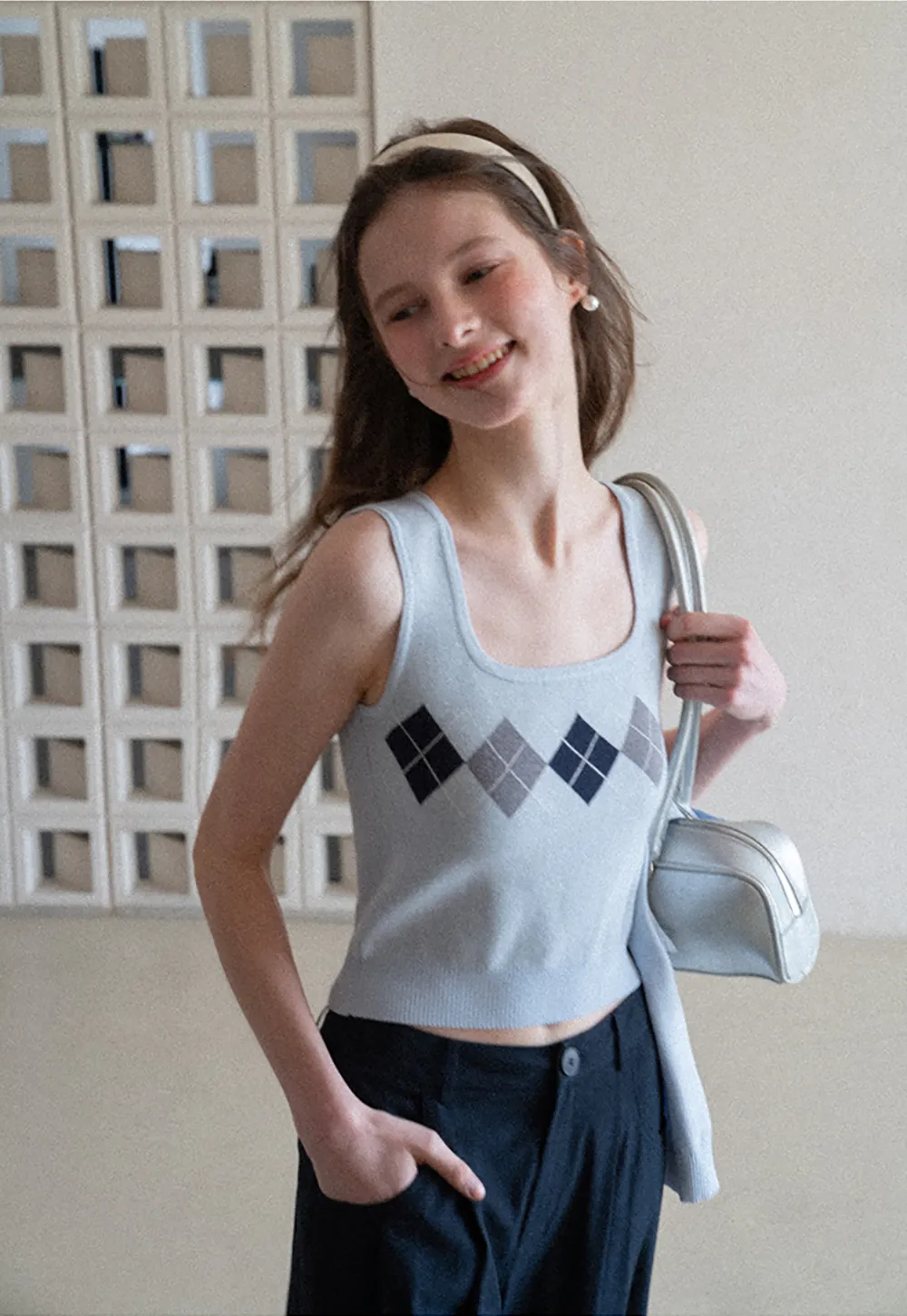 Woolen knit sweater with argyle pattern and buttons