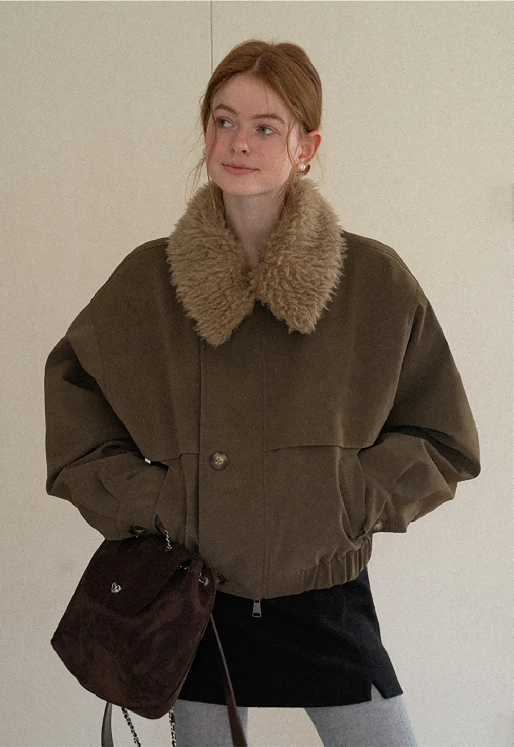 A-line mini skirt with textured fabric and central seam design