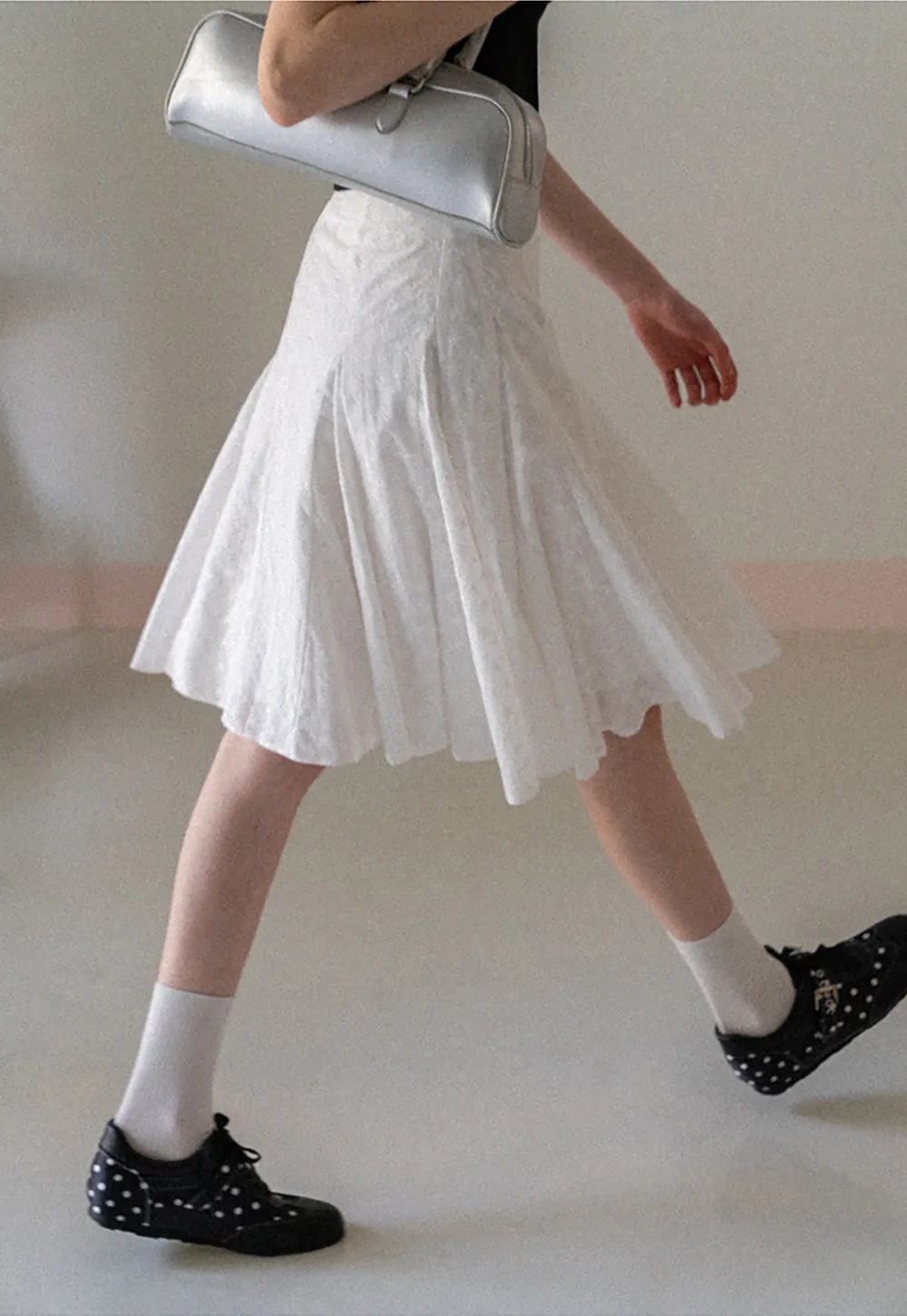 Flared pleated skirt with subtle texture