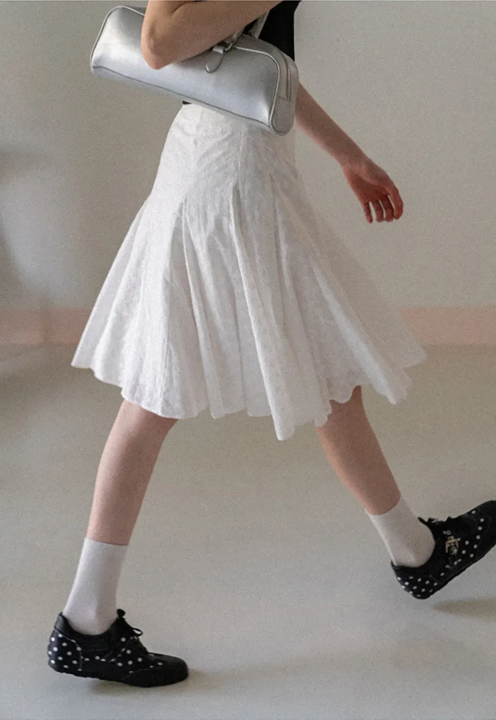 Flared pleated skirt with subtle texture