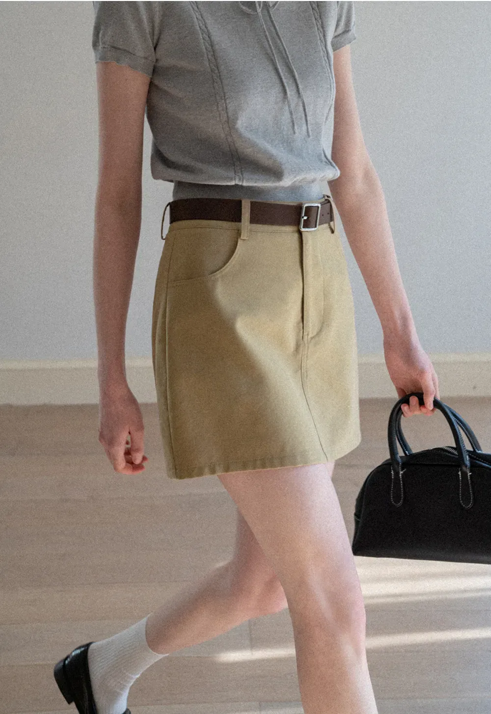 A-line mini skirt with front pockets and belt loops