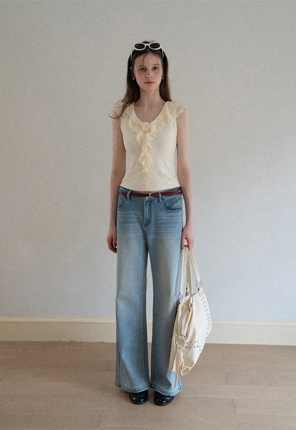 Sleeveless Top with Ruffled V Neck and Floral Detail