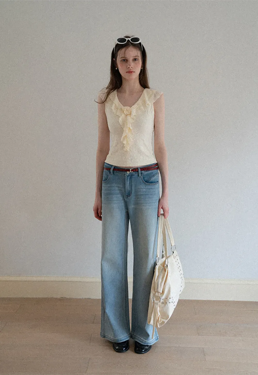 Sleeveless Top with Ruffled V Neck and Floral Detail