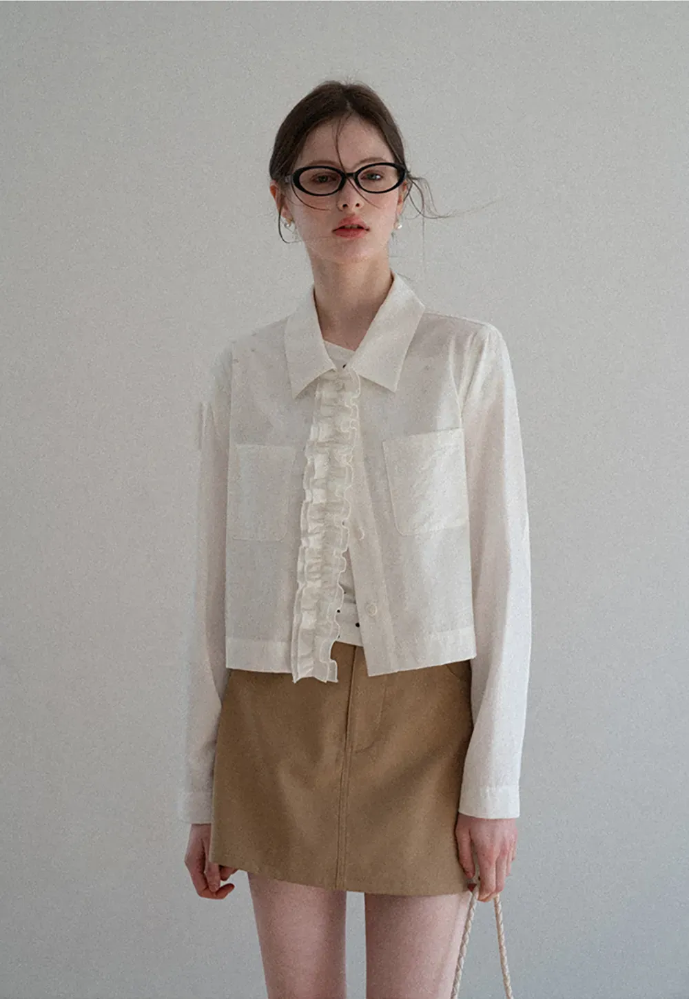 Short jacket with ruffled front placket and collar