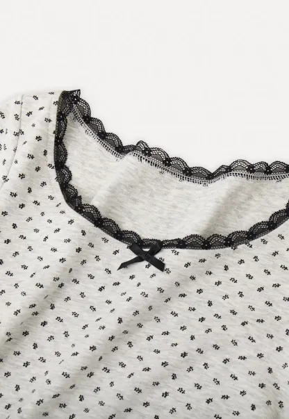 Polka dot dress with lace trim and matching cardigan