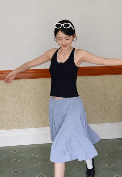 Halter neck tank top with thin straps and bow detail