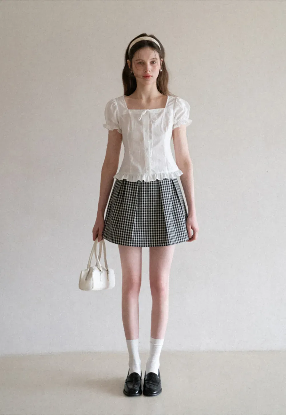 Plaid skirt with pleats and ruffled top