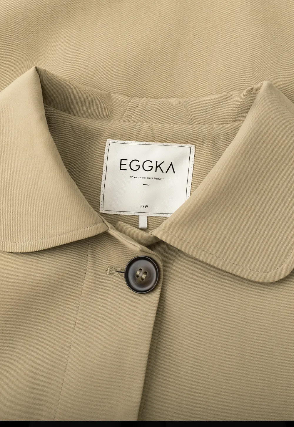 Elegant Trench Coat with Button Detailing and Pockets