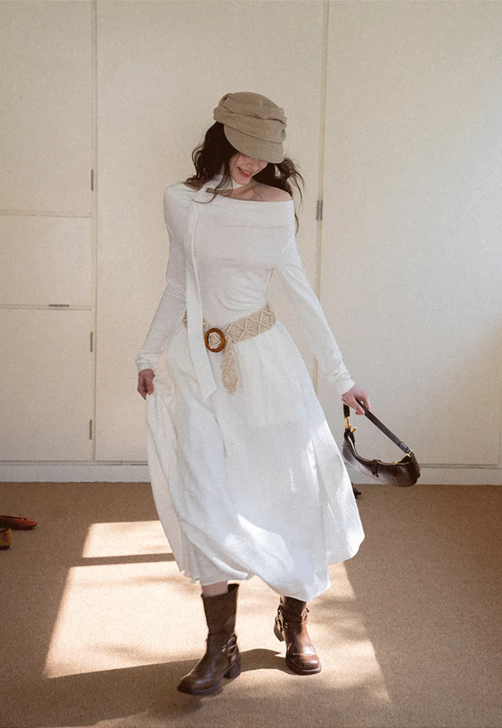 Elegant asymmetrical long sleeve dress with unique belt design