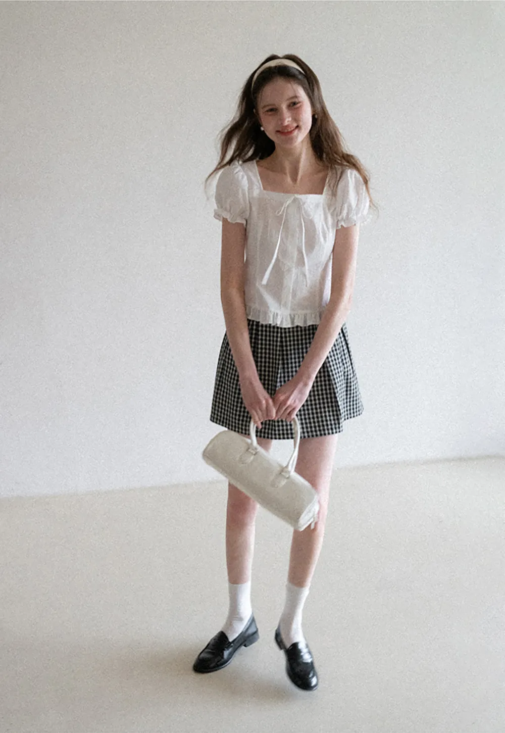 Plaid skirt with pleats and ruffled top