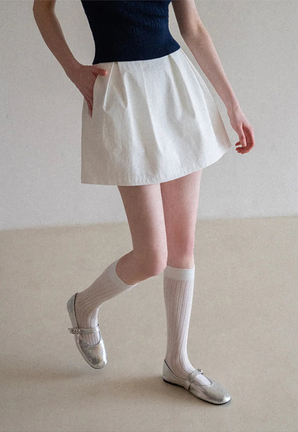 Plaid skirt with pleats and ruffled top