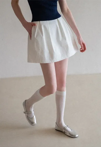 Plaid skirt with pleats and ruffled top