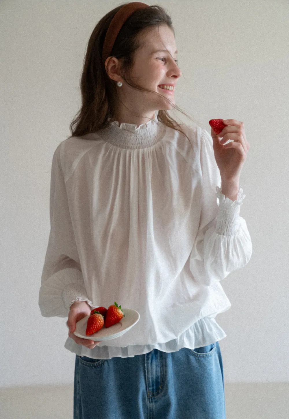 Elegant High Neck Blouse with Ruffled Cuffs and Hem