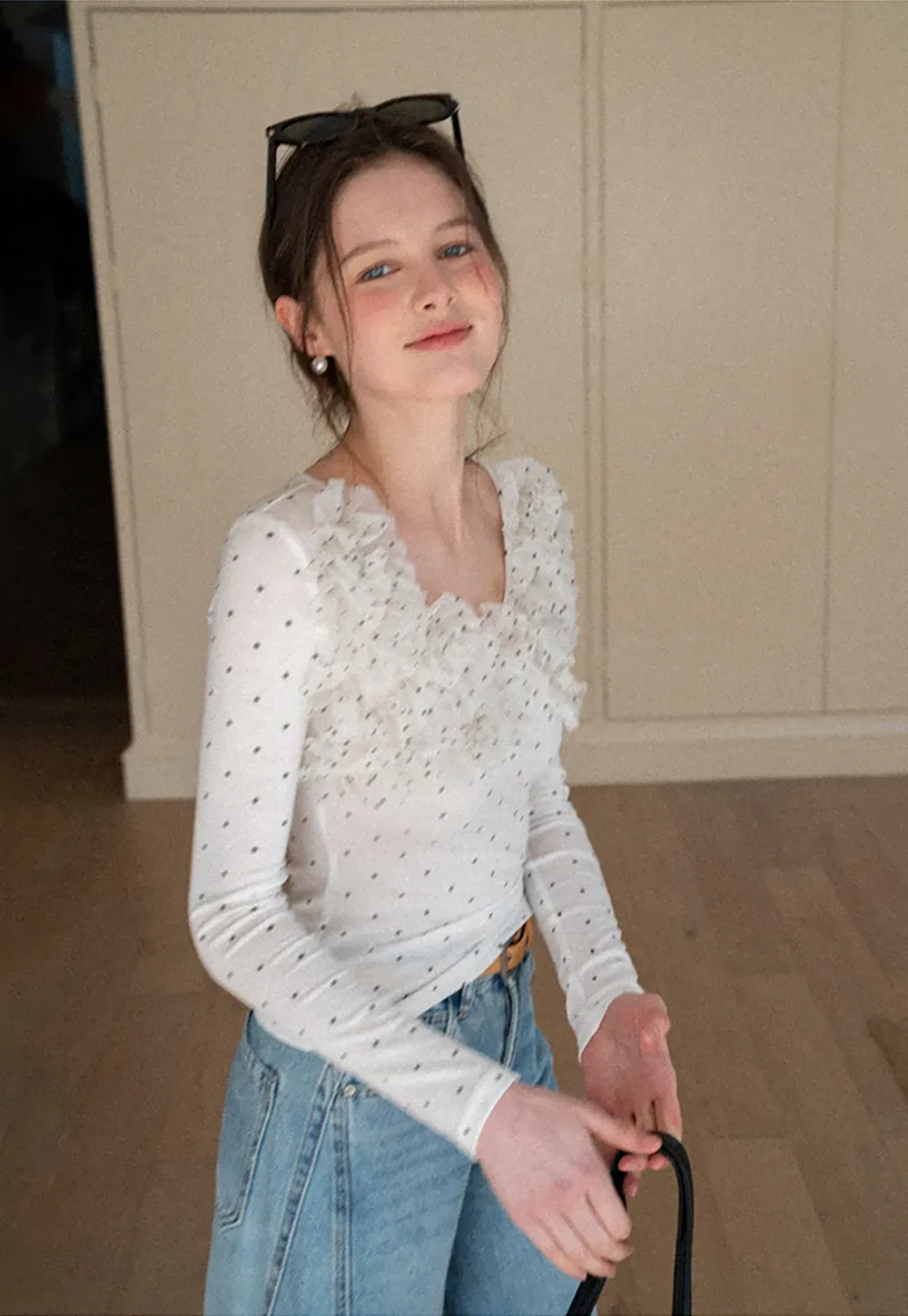 Polka dot long sleeve top with ruffled neckline