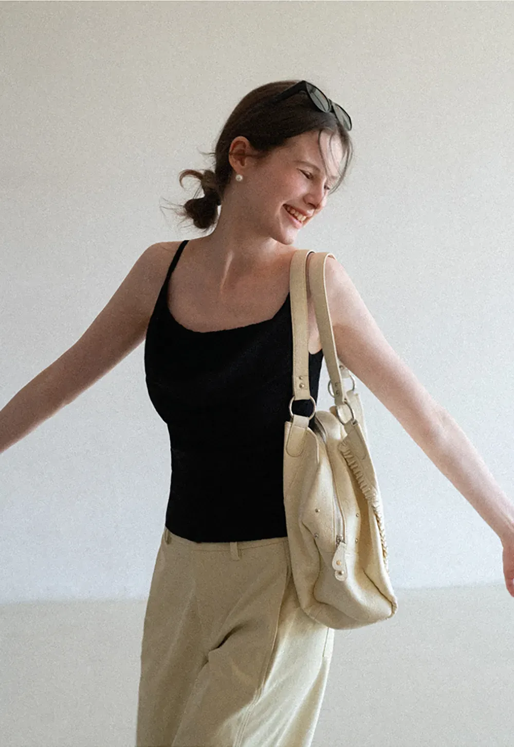 Silk-like tank top with thin straps and draped neckline