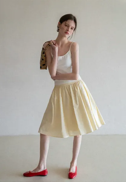 Gray tank top with small embroidered cross detail