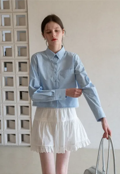 Long sleeve button front shirt with scalloped hem