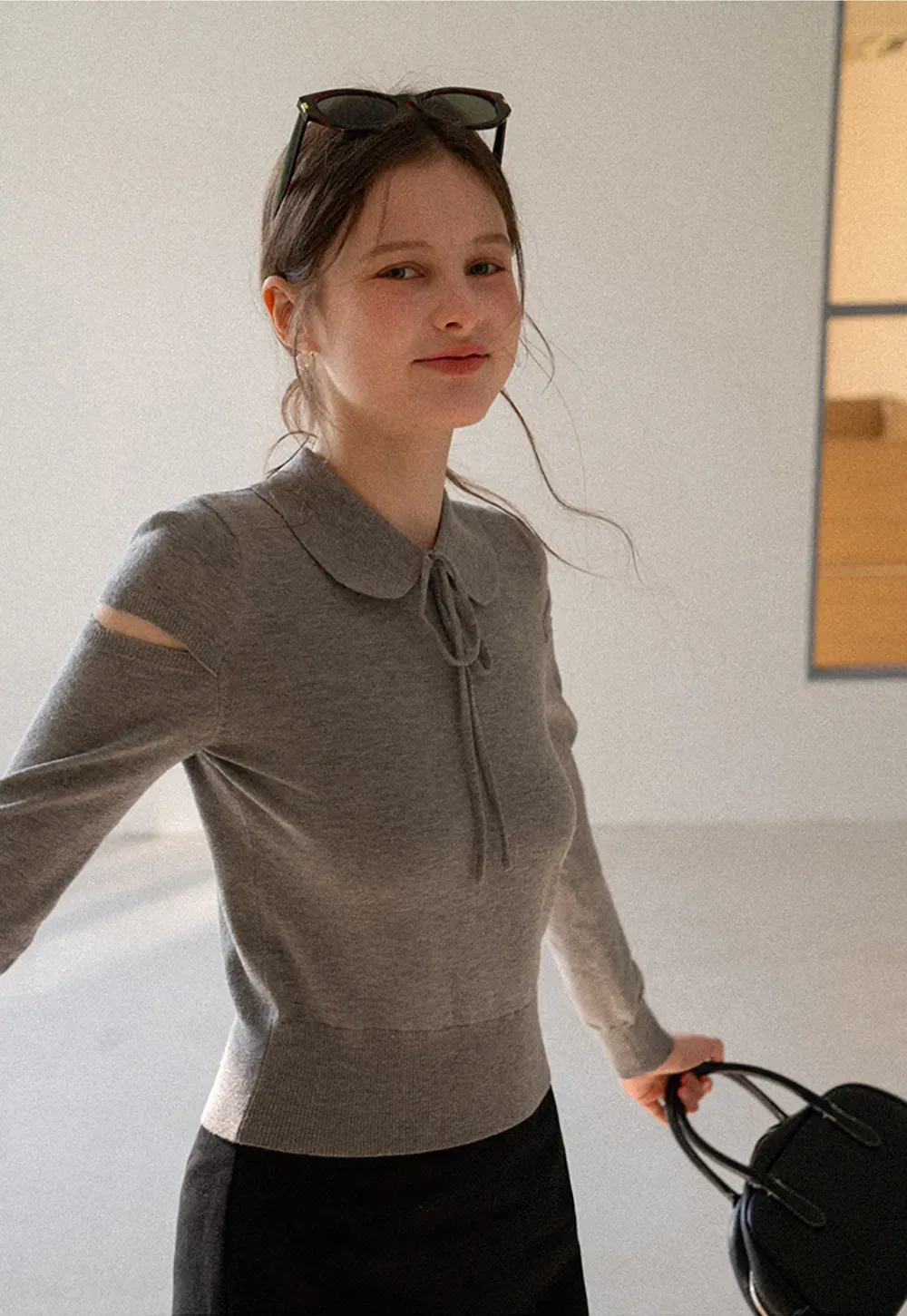 Elegant Knit Sweater with Bow Detail and Cutout Sleeves