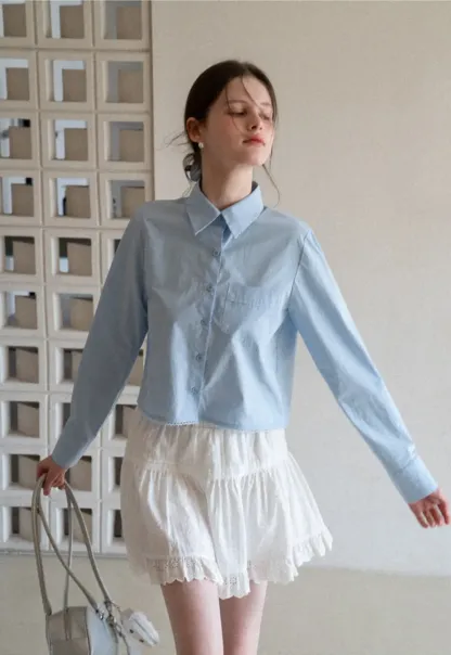 Long sleeve button front shirt with scalloped hem