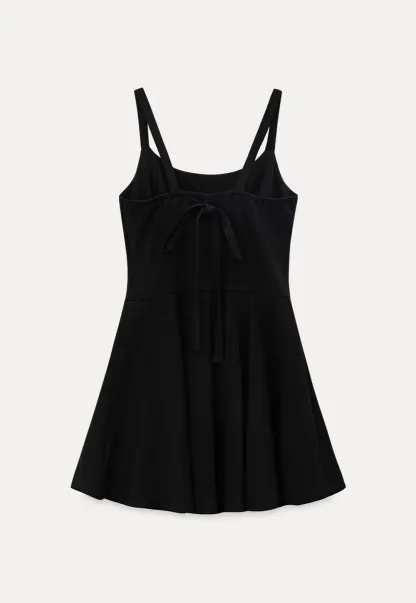 Sleeveless dress with thin straps and flared skirt