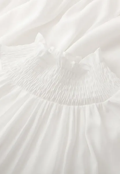 Elegant High Neck Blouse with Ruffled Cuffs and Hem