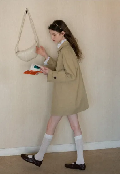 Elegant Trench Coat with Button Detailing and Pockets