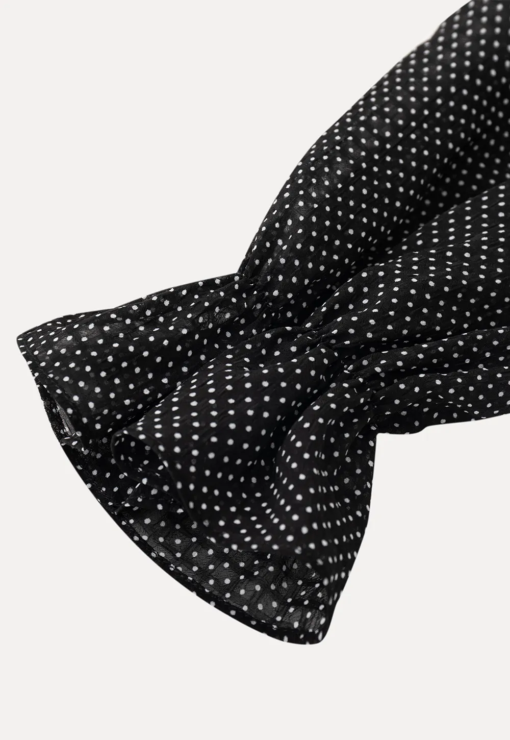 Polka Dot Sheer Blouse with Ruffled Hem and Tie Neck