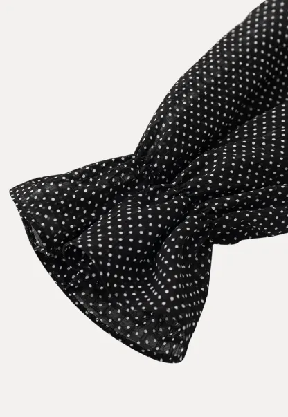 Polka Dot Sheer Blouse with Ruffled Hem and Tie Neck