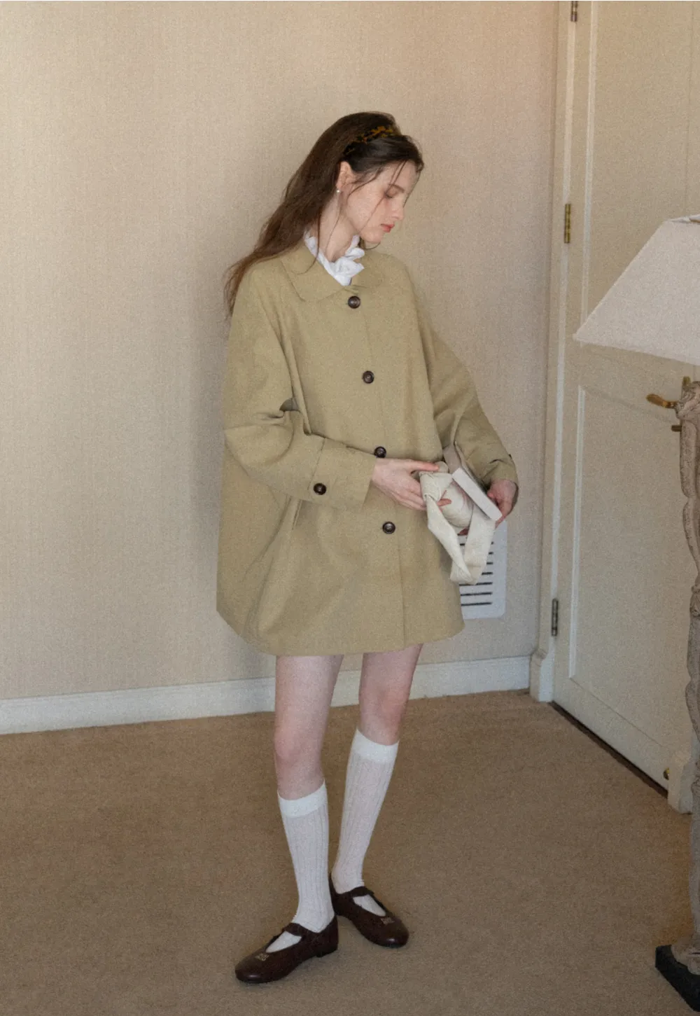 Elegant Trench Coat with Button Detailing and Pockets