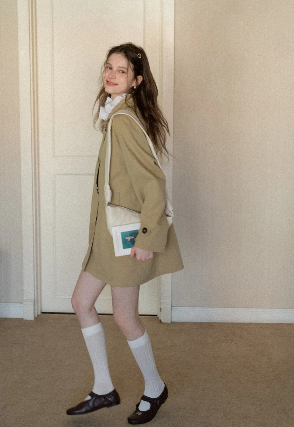 Elegant Trench Coat with Button Detailing and Pockets